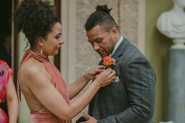 Groom and mother poppy flower in suit jacket