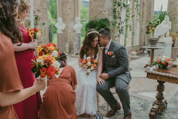 Bridesmaid groom and bride orange and yellow roses/flower bouquet