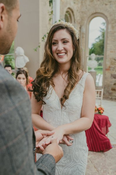 Bride and groom hold hands wedding bands/rings