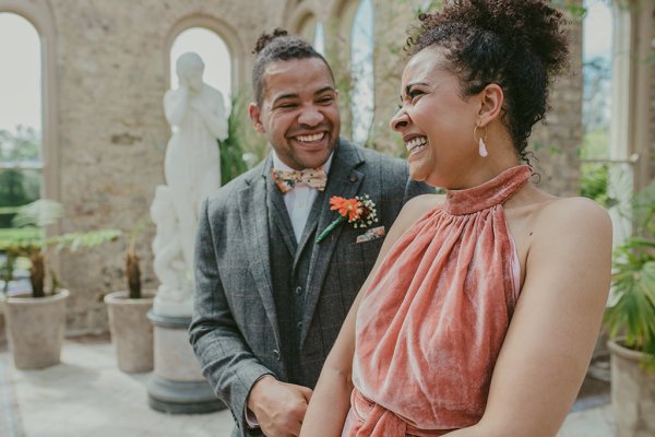 Groom and mother smile/laugh