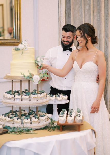 Bride and groom cut the wedding cake