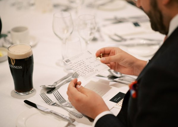 Man looks at card/menu table detail