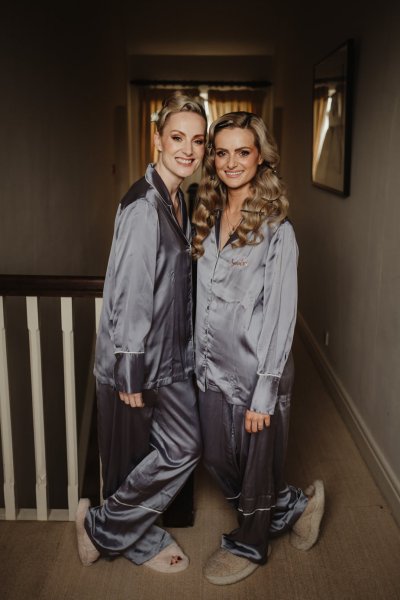 Bride and bridesmaid satin bridalwear smile