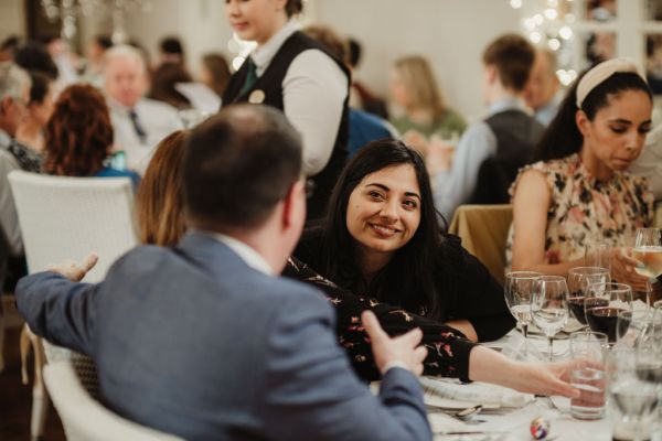 Guests talk at table