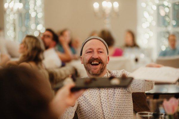 Man laughs in audience