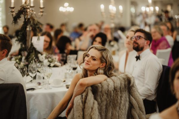 Woman in audience looking at speeches