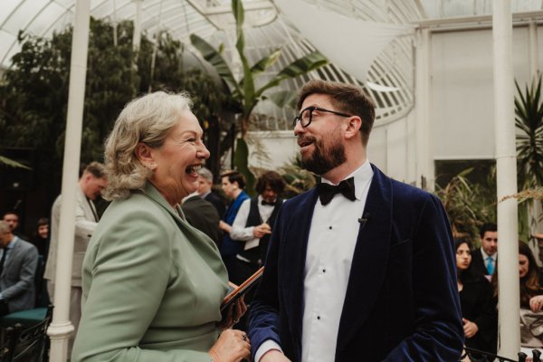 Groom and officiant in green