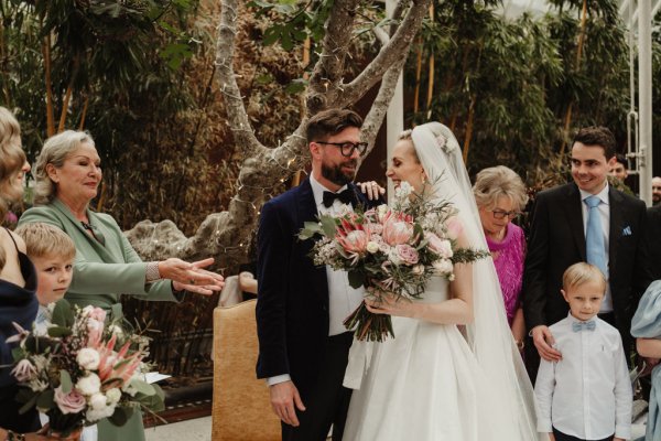 Bride and groom officiant bouquet of flowers