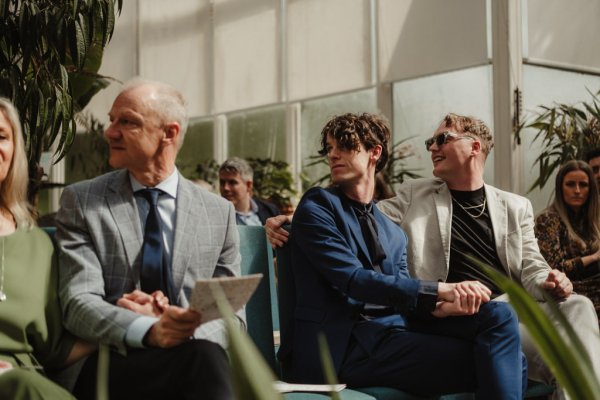 Guests looking at couple during ceremony