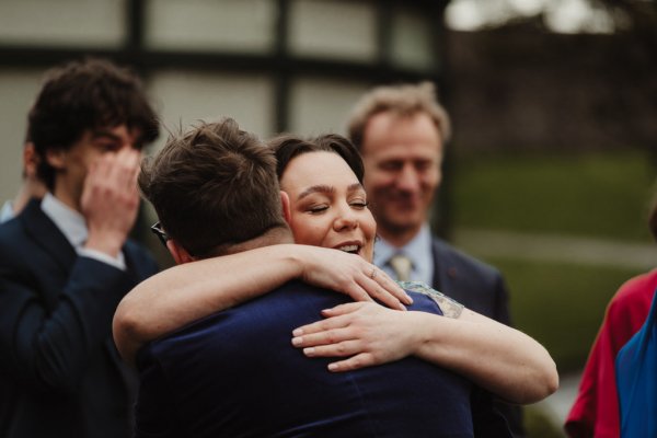 Guests hugging each other