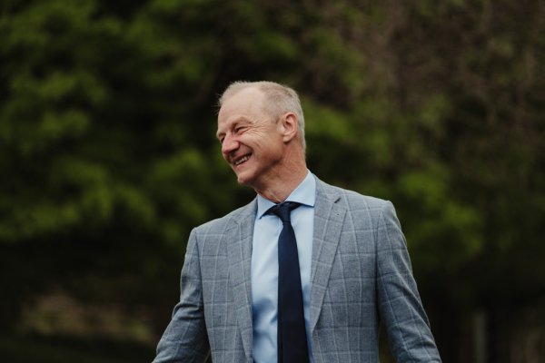 Man in suit smiling