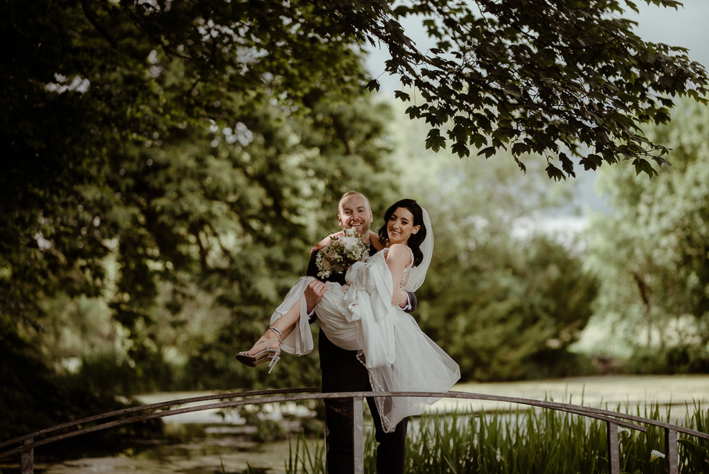 bride and groom in arms