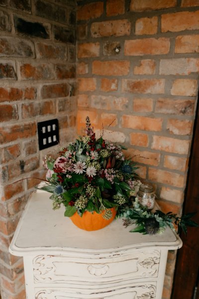 Orange pumpkin and flowers