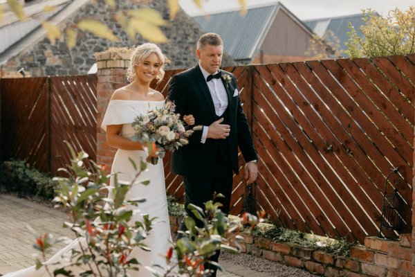 Father walks the bride down the aisle