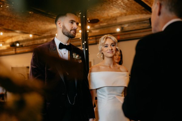 Bride and groom at alter smiling