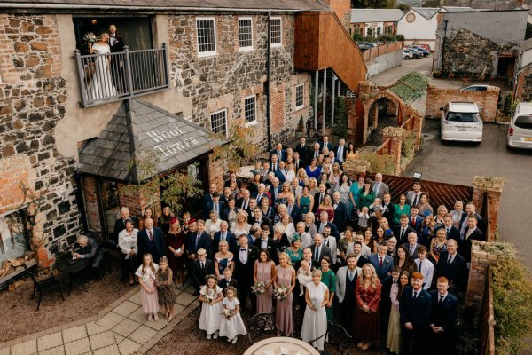 Exterior setting guests outside wedding venue