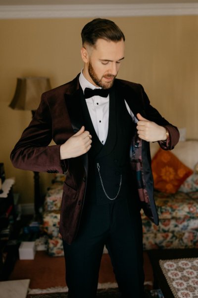 Groom in suit shirt tie and bowtie