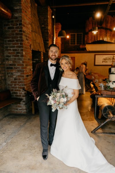 Bride and groom holding flowers