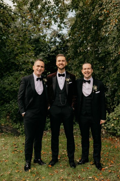 Groom and groomsmen in park