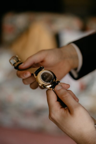 Watch detail on groom