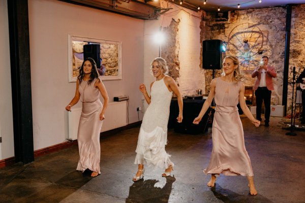 Bride and bridesmaids on the dancefloor dance routine