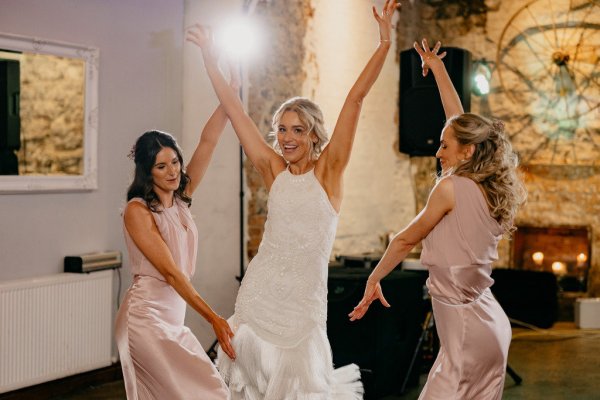 Bride and bridesmaids on the dancefloor dance routine