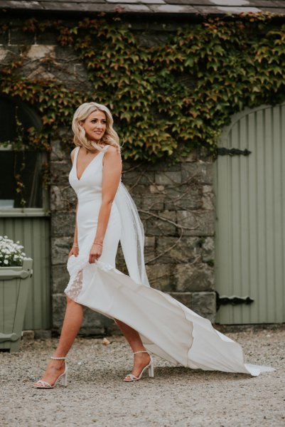 Bride shows of bridal heels/shoes on farm