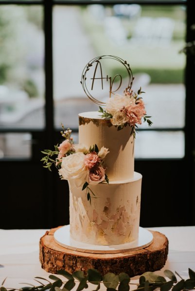 White wedding cake detail with flowers on top