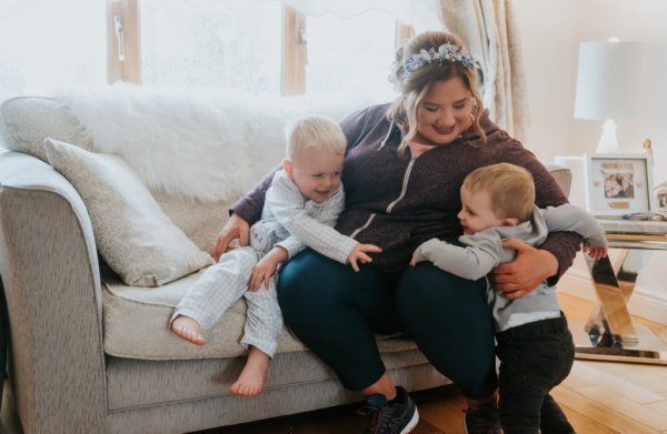 Mother wearing tiara and two boys babies