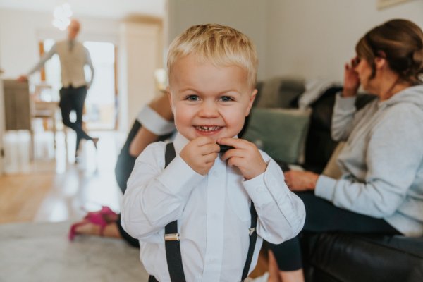 Little boy in bow tie suit shirt laughing smiling