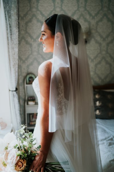 Veil bridal gown/dress detail bride and flowers