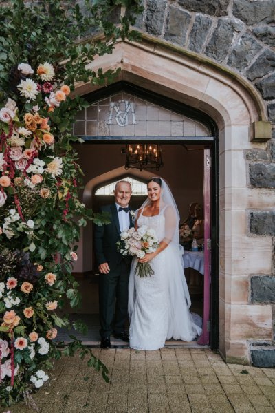 Father of the bride exterior church ceremony setting flowers roses bouquet