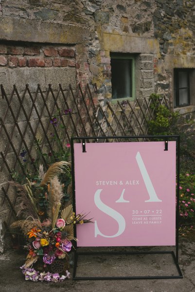 Steven & Alex wedding pink sign and flowers