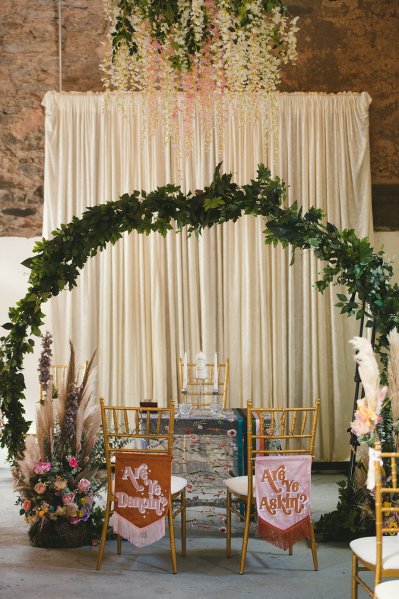 Empty ceremonial room chairs and flowers