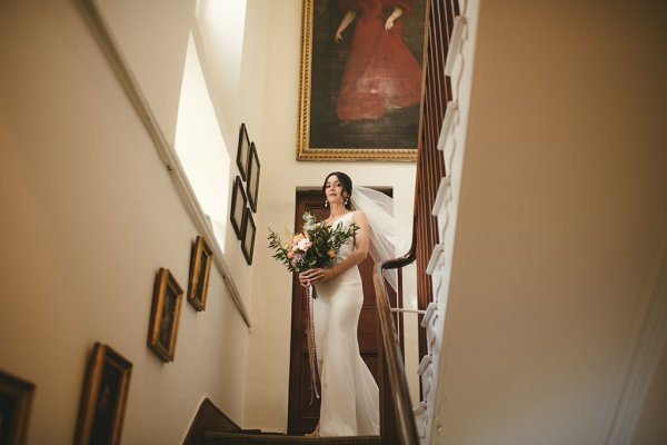 Bride makes her way down the stairs