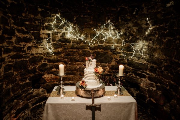 White wedding cake lights and candles