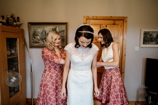 Bridesmaids and bride getting ready