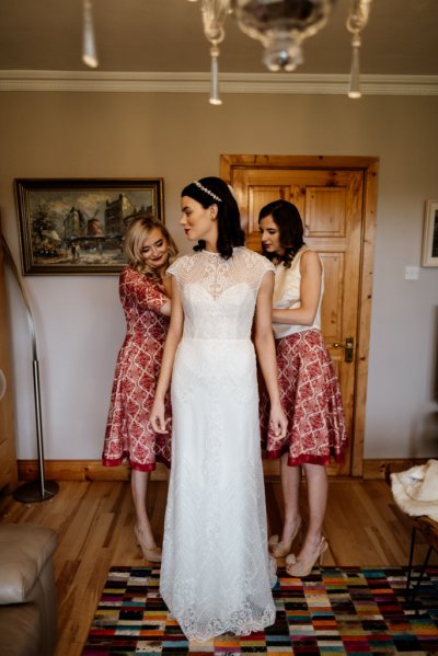 Bridesmaids and bride getting ready