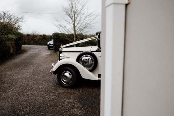 White wedding car with ribbon