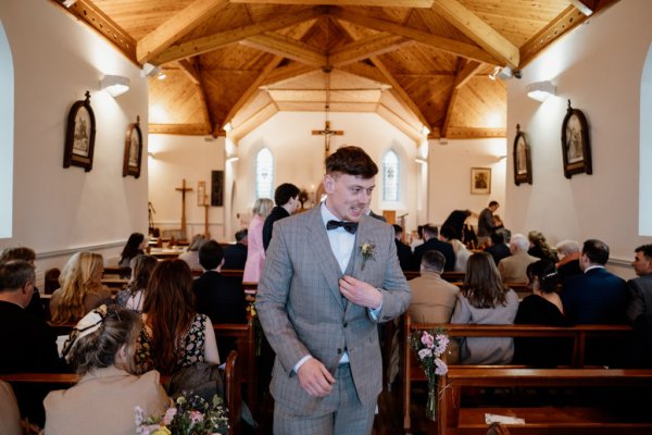 Groom inside church waiting for bride