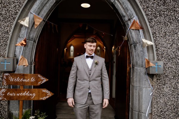 Groom exterior wedding church ceremony entrance