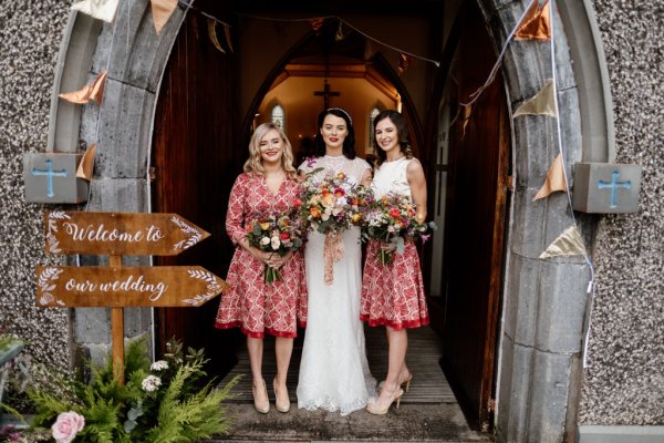 Bride and bridesmaids holding flowers/bouquet