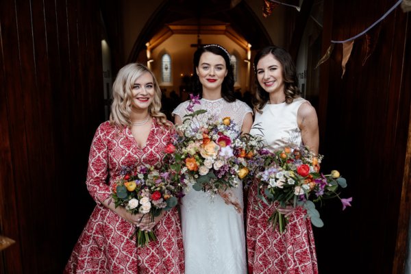 Bride and bridesmaids holding flowers/bouquet