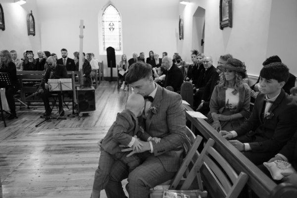 Groom and son sitting