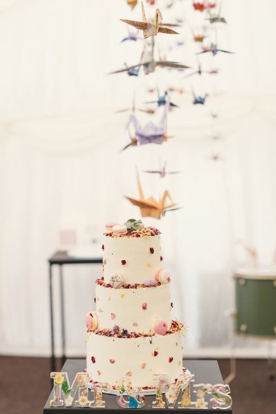 Macaroons in cream white floral flower cake