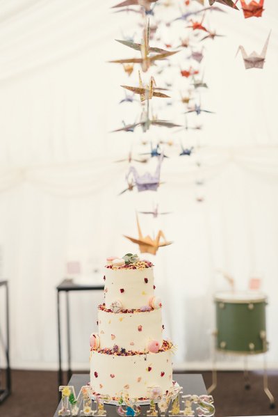 Macaroons in cream white floral flower cake