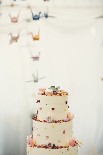 Macaroons in cream white floral flower cake