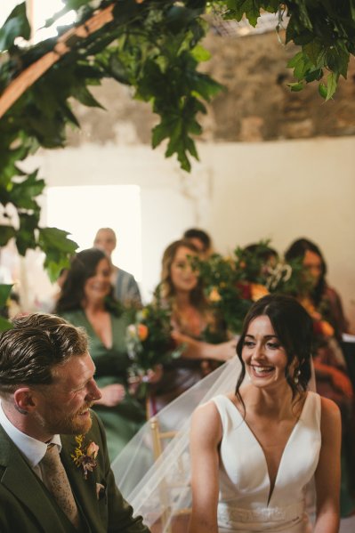 Bride smiles at groom