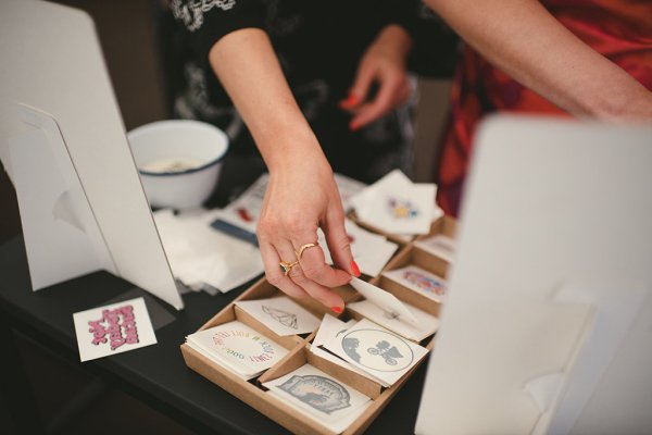 Temporary tattoos in wooden box female hand