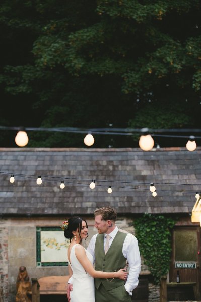 Bride and groom evening exterior shot lights